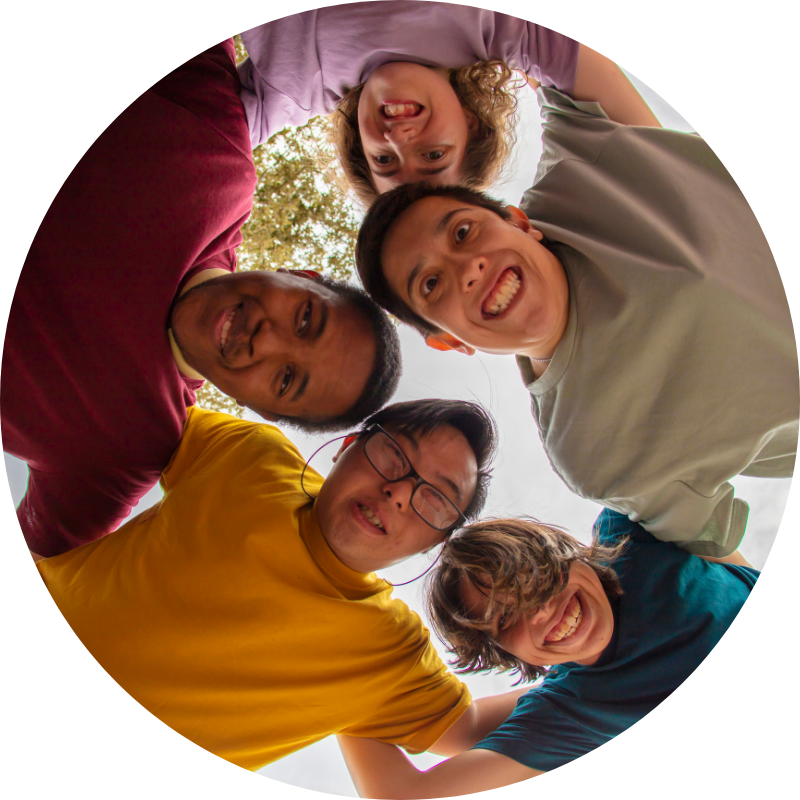 Group of kids looking down at the camera